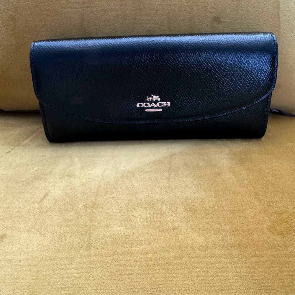Coat, black leather wallet…